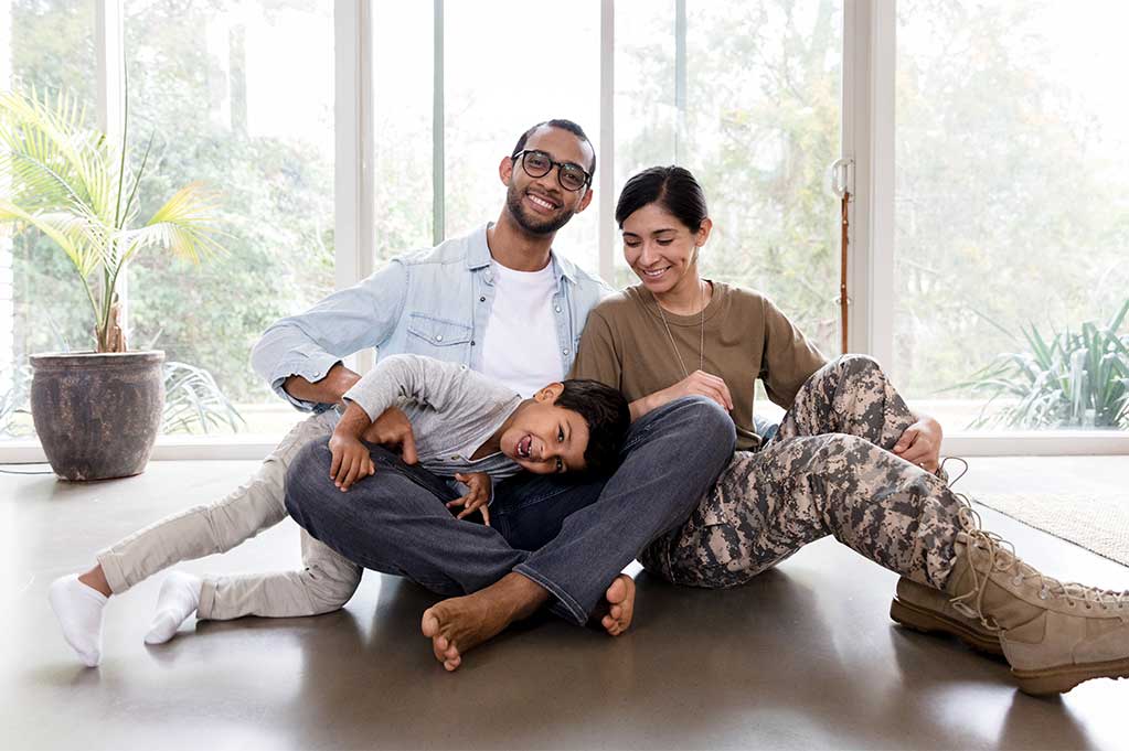 Military family smiling at the camera