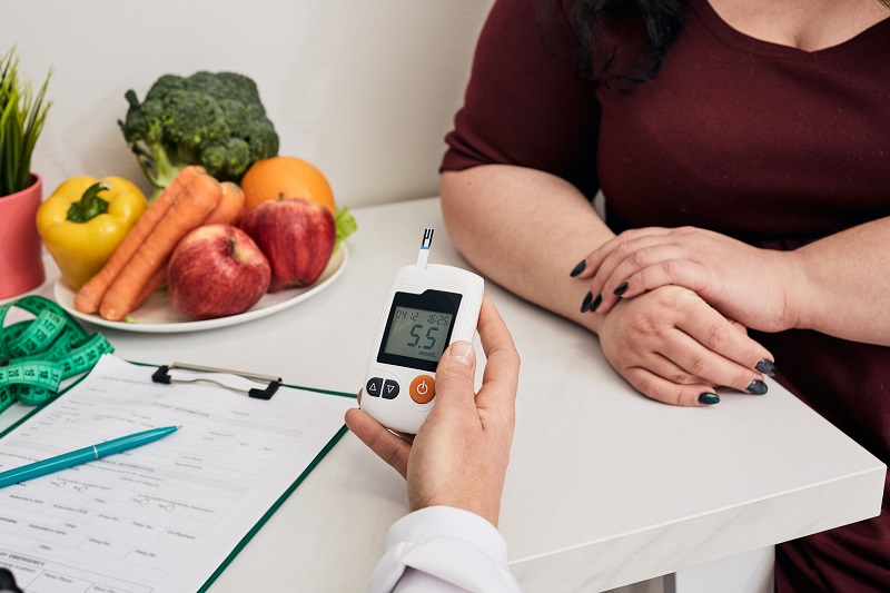 Patient having blood sugar level checked at the doctor's office.