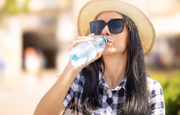 Woman drinking bottle of water