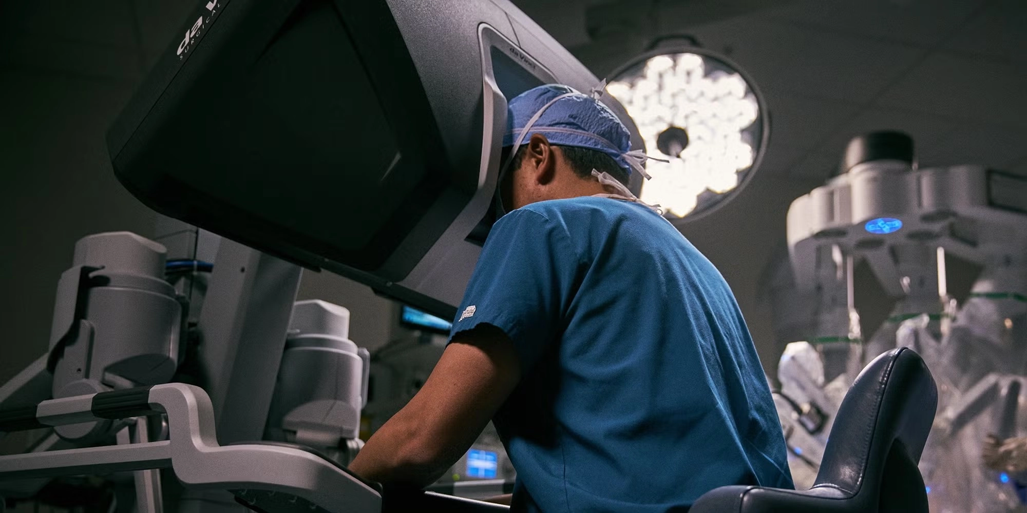 A surgeon performs robotic surgery