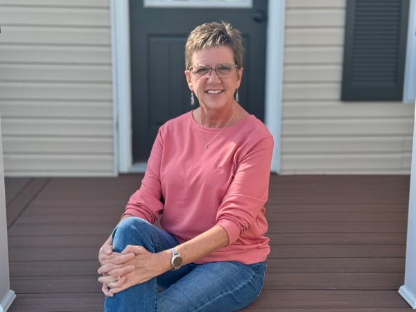 Katy seated outdoors and smiling
