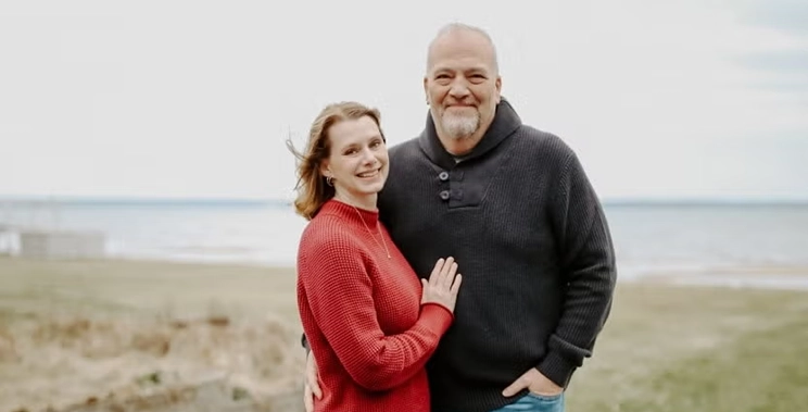 Jen Bailey on a chilly beach with her husband