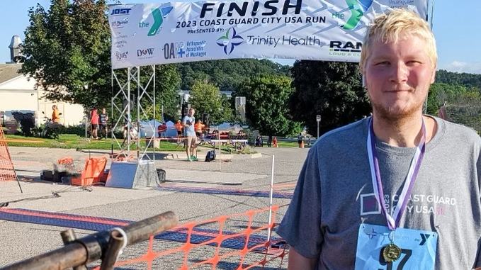 Mark Cubitt smiling at the end of the 2023 Coast Guard Race in Grand Haven