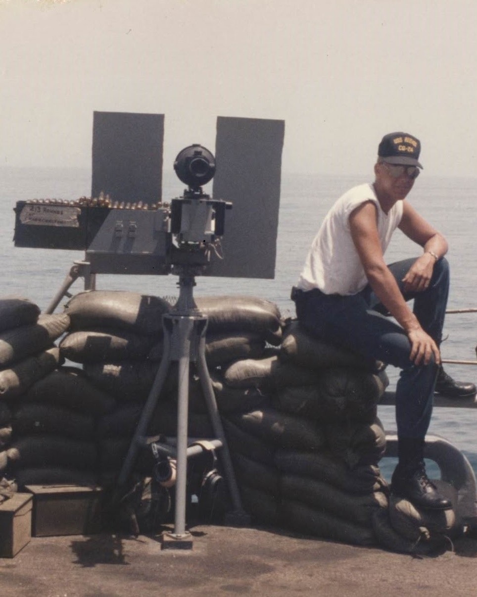 Soldier sitting on sand bags
