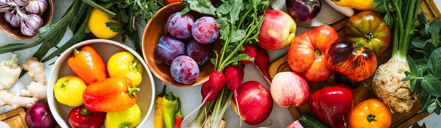 A bundle of assorted vegetables, including radishes, peppers and ginger.